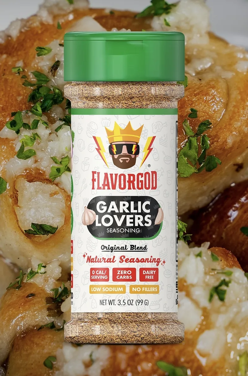 A Flavorgod Garlic Lovers seasoning shaker over garlic knots