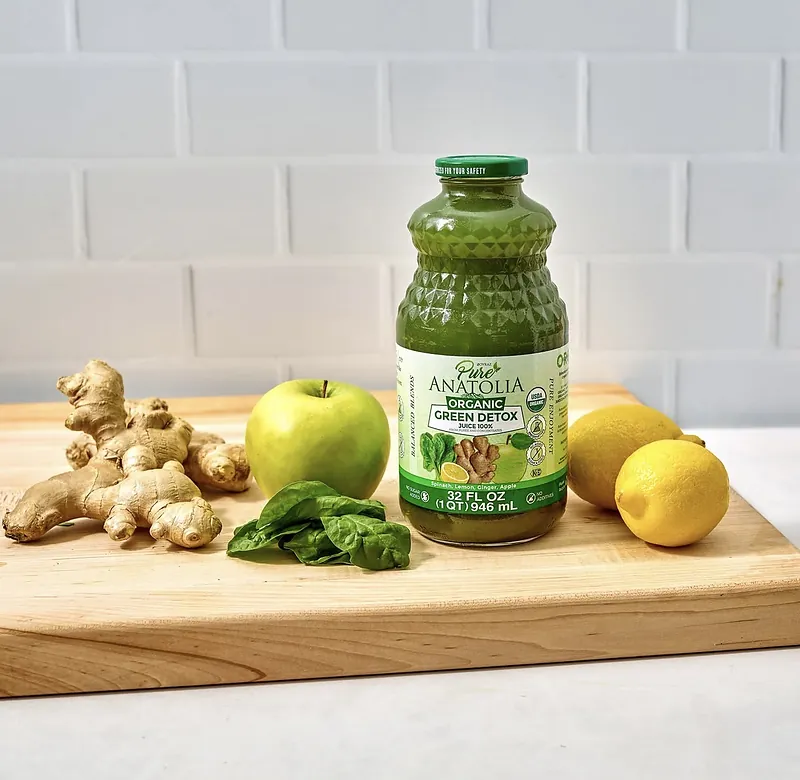 A Pure Anatolia Organic Green Detox juice with ginger, apple, spinach and lemons