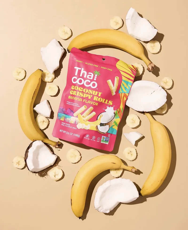 A Thai Coco Coconut Crispy Rolls banana flavor pouch with bananas and fresh coconut